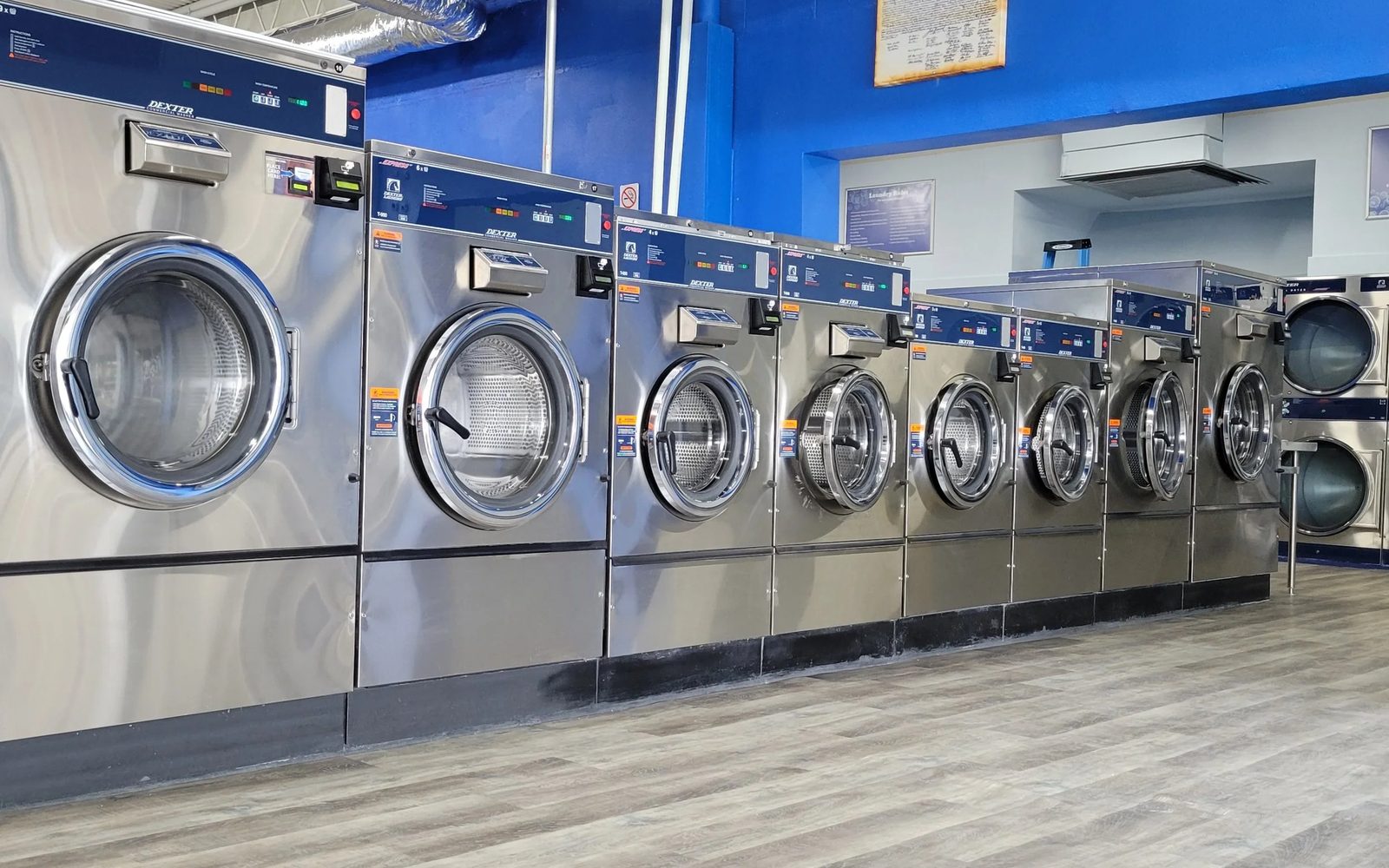 Rows of clean, modern washing machines at a Brite Wash-style laundromat